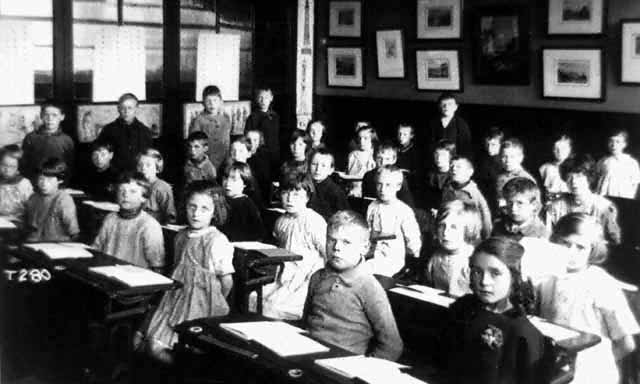 Children posing for a picture in a classroom