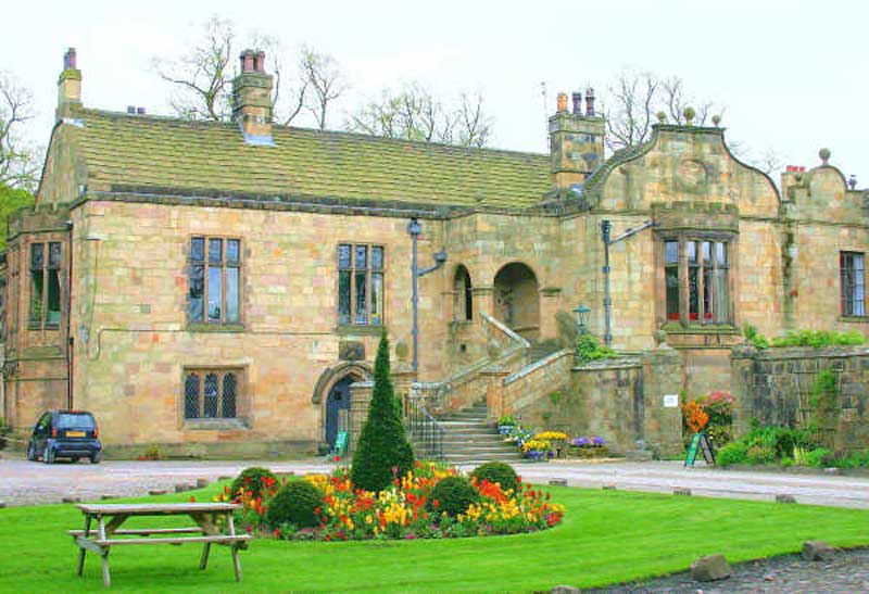 Calderstones Hospital, standing in front is a garden